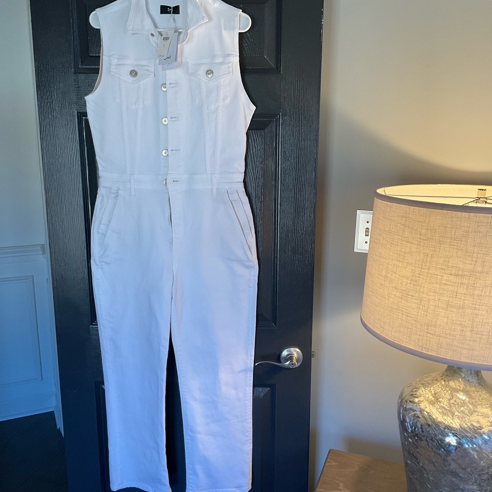 LUXURY NEVER WORN. VERY FLATTERING. New with tags. 3x1 White Denim Jumpsuit.